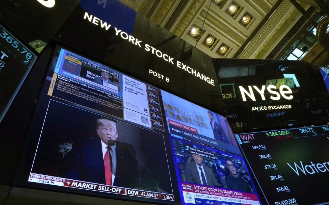 Traders work on the floor of the New York Stock Exchange (NYSE) in the Financial District in New York City on March 4, 2025. (Photo by TIMOTHY A. CLARY / AFP)