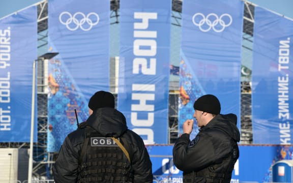 Police patrol  the Olympic Park's medal plaza.