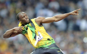 Usain Bolt strikes his pose after winning the men's 200m final at the London Olympics.