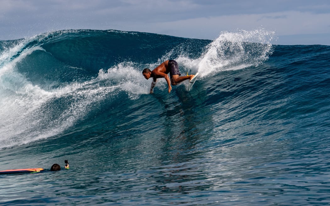 A Surfer training days out from Billabong's annual Tahiti competition at Teahupoo reef. TAHITI, FRENCH POLYNESIA - AUGUST 5 2018