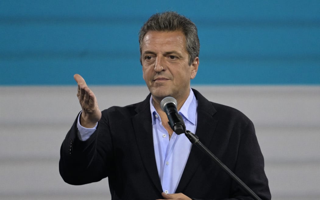 Argentine Economy Minister and presidential candidate for the Union por la Patria party, Sergio Massa, gestures to supporters after knowing the results of the presidential election runoff at his party headquarters in Buenos Aires on November 19, 2023. Libertarian outsider Javier Milei will be Argentina's next president, said his rival, Economy Minister Sergio Massa, who conceded defeat after Sunday's election.