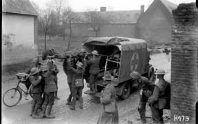 Wounded New Zealand soldiers are placed in a motorised ambulance in France.