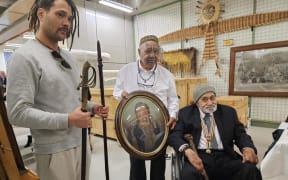 Whānau members with the taonga housed in Te Papa's archives.