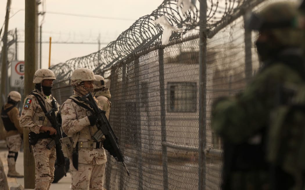 Members of the Mexican Army secure an area outside the prison of Ciudad Juarez number 3 after an attack in Ciudad Juarez, Chihuahua.