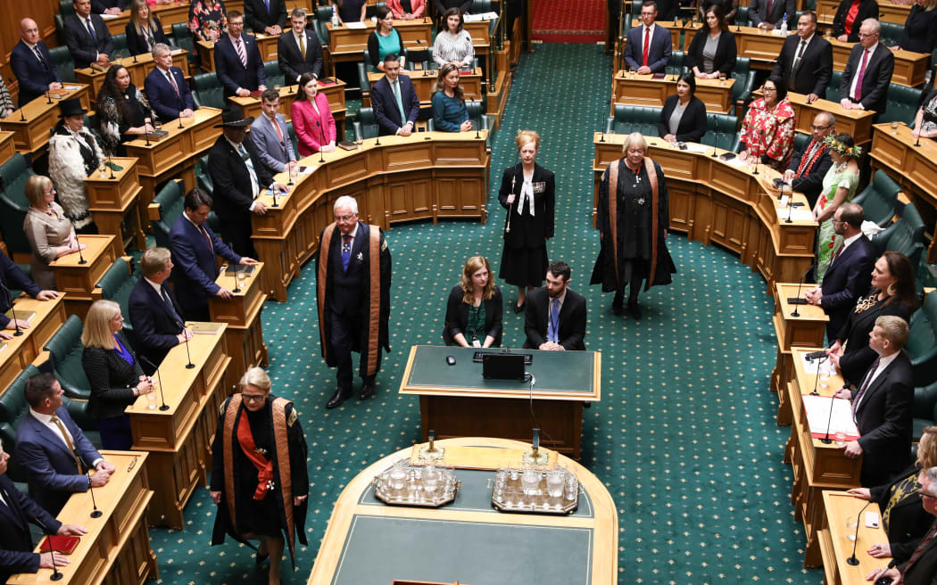 Black Rod and the Commissioners enter Parliament's Debating Chamber