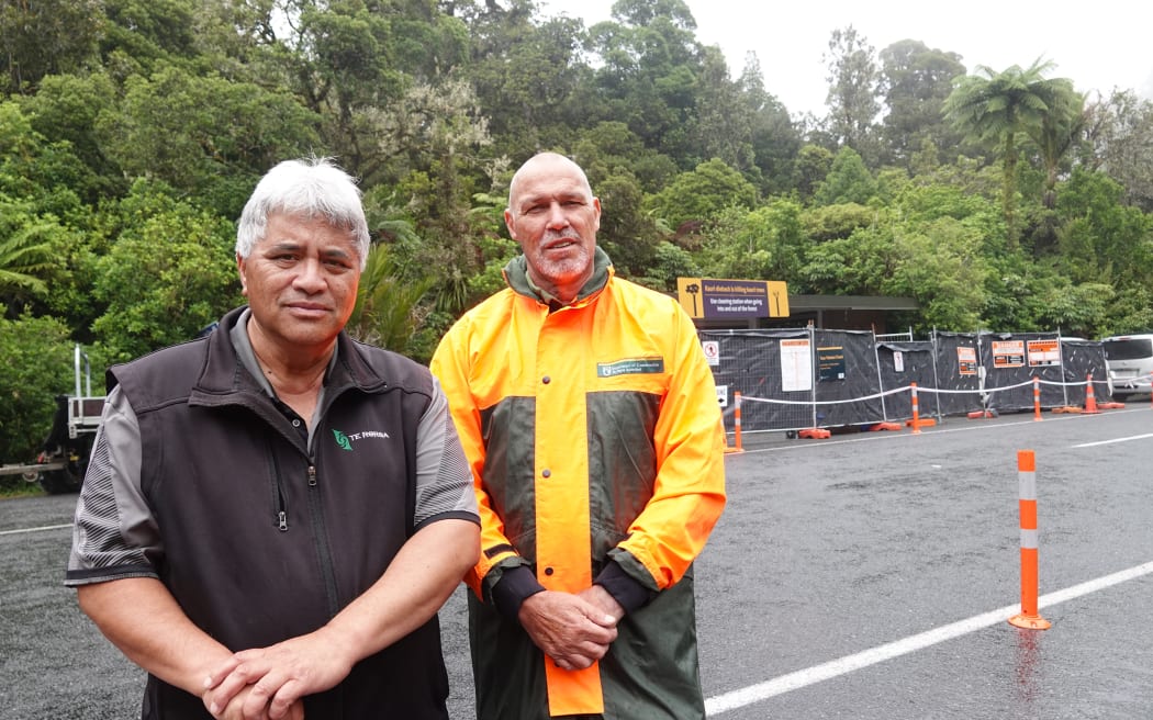 Te Roroa Development group general manager Snow Tane and DOC Kauri Coast operations manager Stephen Soole at the entrance to the Tāne Mahuta Walk.