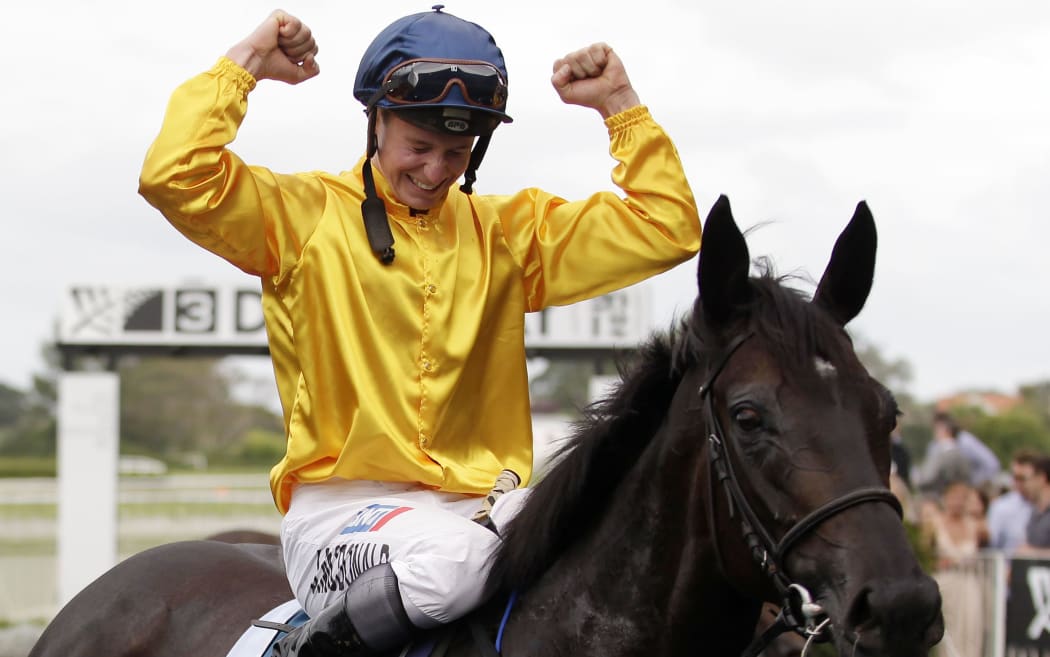 James McDonald celebrates winning 2012 New Zealand Derby on Silent Achiever.