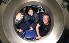 Ready for deployment to the Scholl Deep, from left to right, HOV Fendouzhe pilots Xin Yuan and Yuqing Deng with Kareen Schnabel (NIWA).