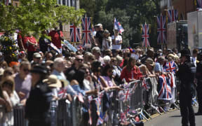 Fans gather in Windsor Castle to celebrate the wedding between Prince Harry of Wales and Ms Meghan Markle.