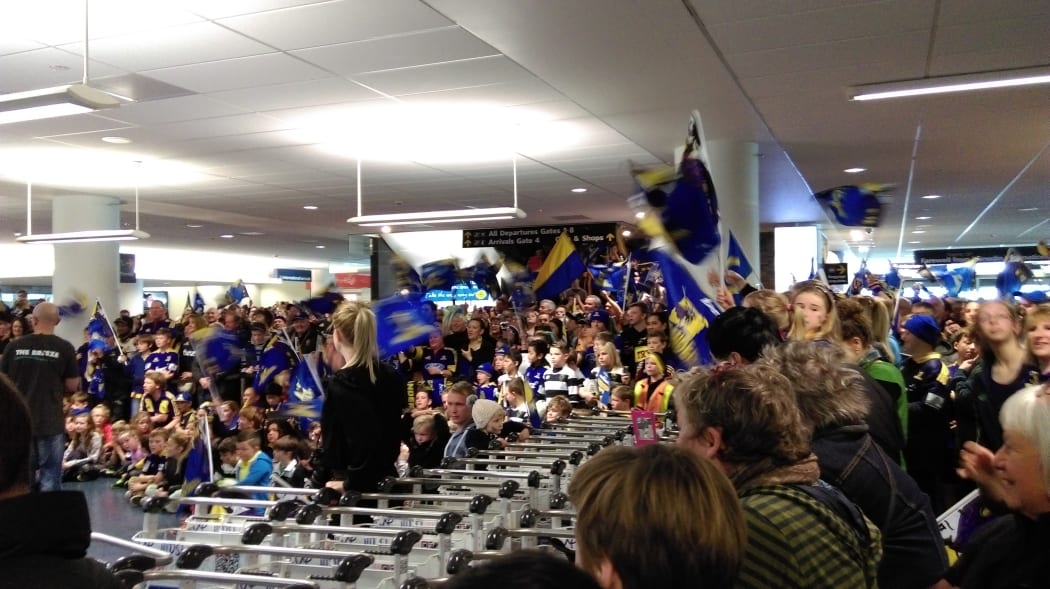 Highlanders flags await victorious team's arrival at Dunedin airport