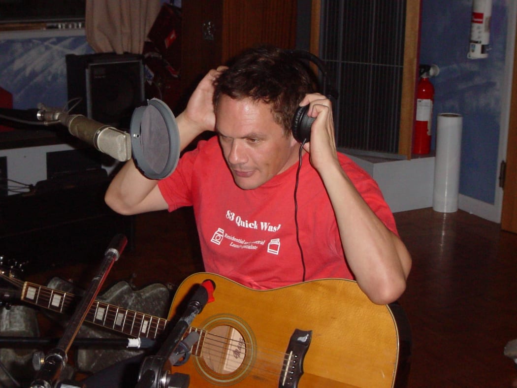 Shayne Carter preparing for a live performance with Dimmer at RNZ's Helen Young Studio
