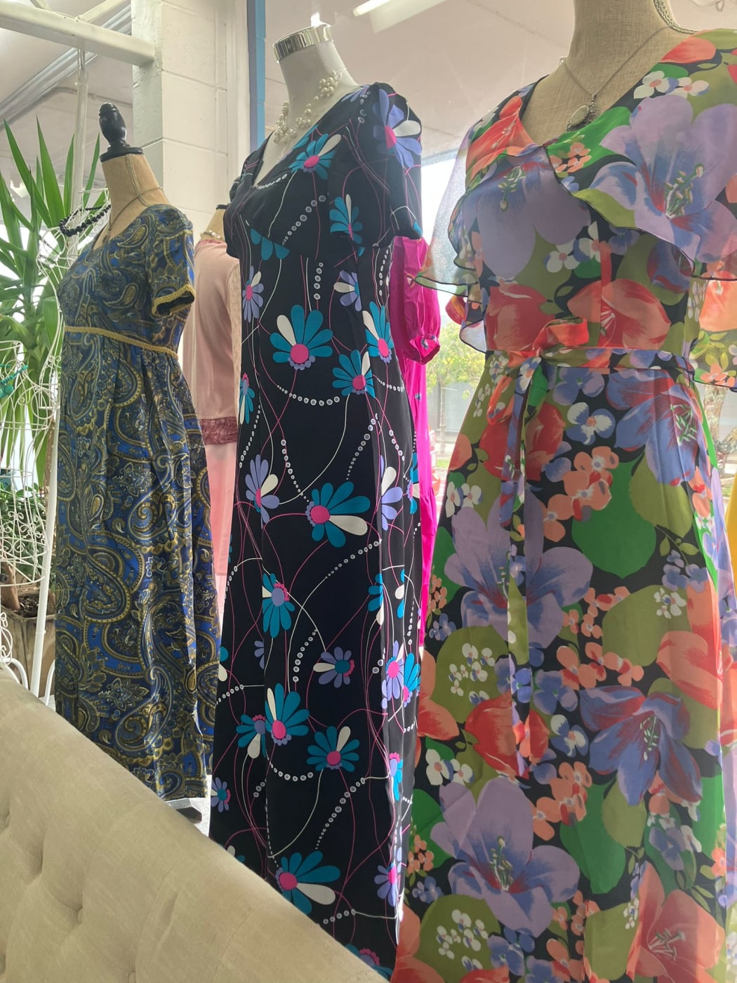 Picture shows three vintage dresses.