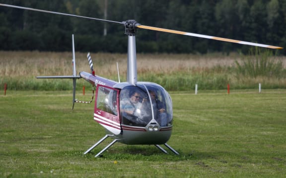 A file photos shows a Robinson R44 helicopter taking off in Latvia in 2011.