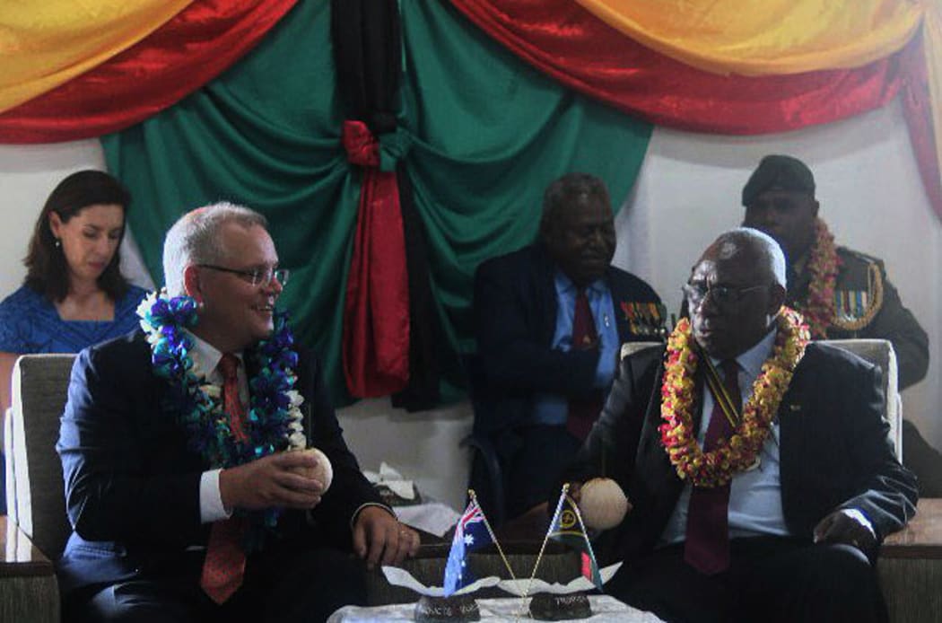 Australian PM Scott Morrison is greeted by Vanuatu President Obed Tallis at the State House.
