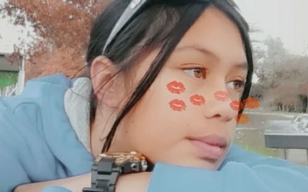 An image of an 11-year-old girl wearing sunglasses on her head and looking off to the side with a photo filter of multiple lips covering her cheeks.