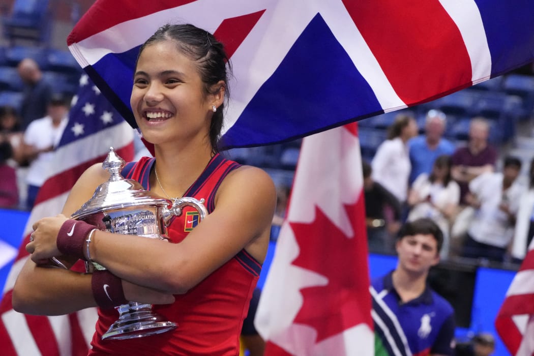 Britain's Emma Raducanu celebrates with the trophy after winning the 2021 US Open Tennis tournament women's final match against Canada's Leylah Fernandez, in September 2021
