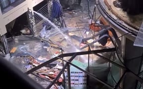 16 December 2022, Berlin: The atrium of a hotel is devastated and lies in ruins. In the Radisson Blue hotel, the huge Sea Life aquarium had burst. Water poured down to the street. - Repetition with other image detail Photo: Iva Yudinski/instagram/tnn/dpa (Photo by Iva Yudinski / instagram/tnn / dpa Picture-Alliance via AFP)