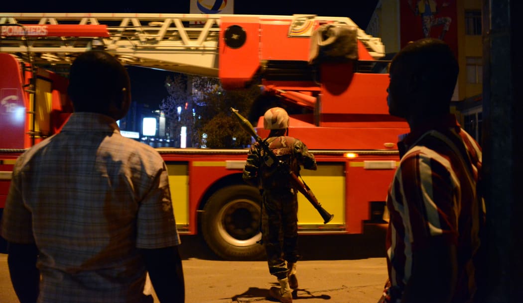 A Burkina Faso soldier stands near Hotel Splendid.