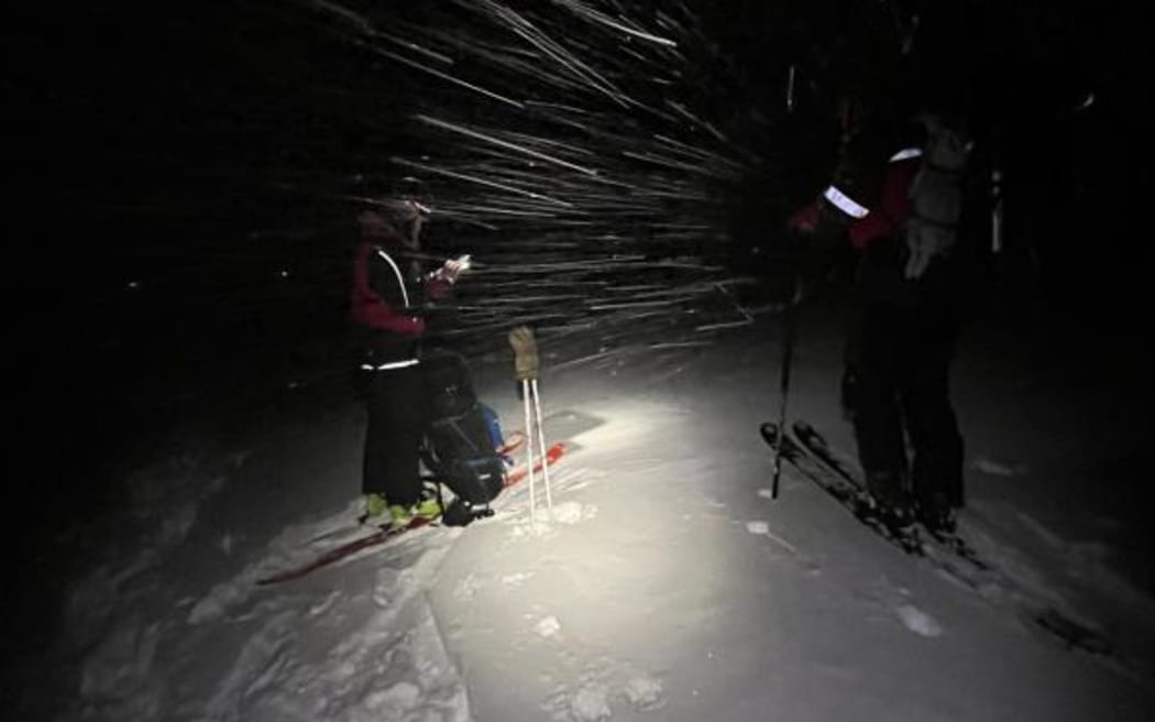 Members of the Alpine Cliff Rescue team in blizzard conditions and with a temperature of -8C.