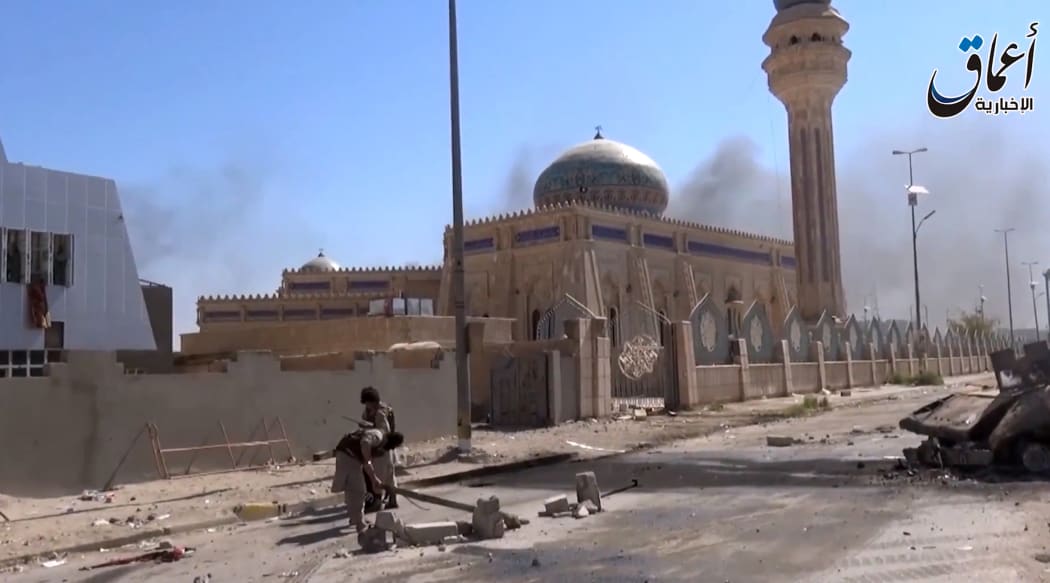 An image grab taken from a video uploaded by Aamaq news agency allegedly showing IS fighters in Ramadi.