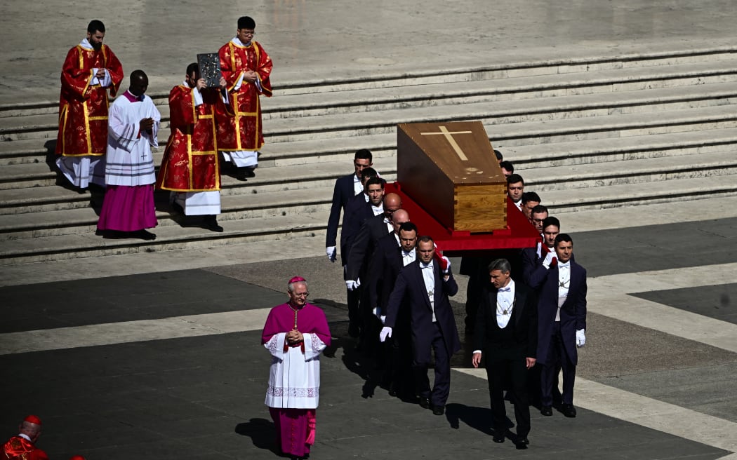 Pallbearers carry the coffin of late Pope Francis during the funeral ceremony in St Peter's Square, at the Vatican, on April 26, 2025. (Photo by Tiziana FABI / AFP)