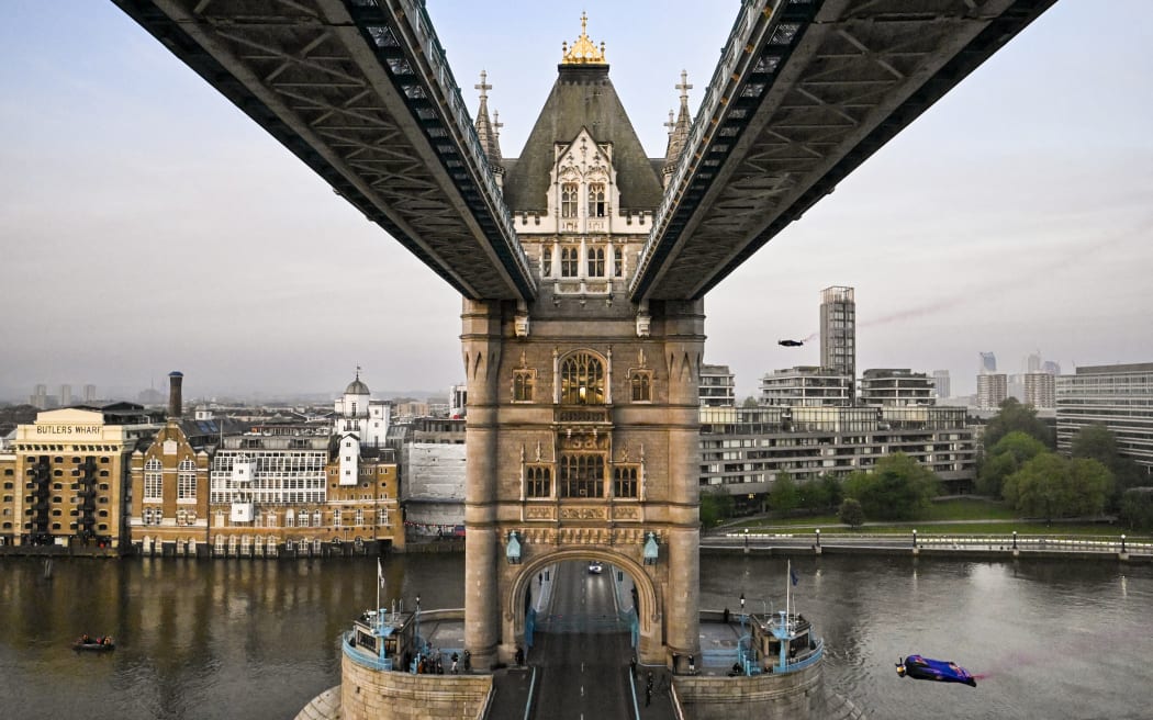 Two Austrian skydivers, Marco Fürst and Marco Waltenspiel, accomplished a remarkable feat by becoming the first individuals to successfully navigate a wingsuit flight through London's iconic landmark, Tower Bridge on May 12, 2024. // Marco Fuerst and Marco Waltenspiel of Austria fly through Tower Bridge in London, Great Britain on May, 12, 2024 // Mihai Stetcu / Red Bull Content Pool (Photo by MIHAI STETCU / Red Bull Content Pool / Red Bull Content Pool via AFP)