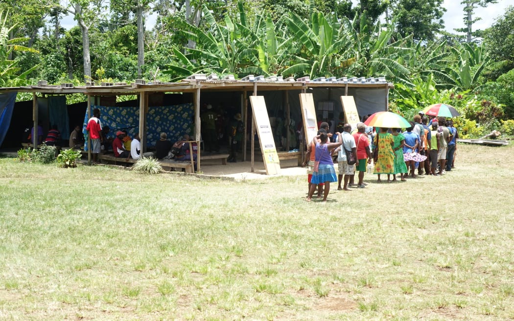 People queue at a polling station in rural Efate, Vanuatu, for the 2016 Vanuatu election.