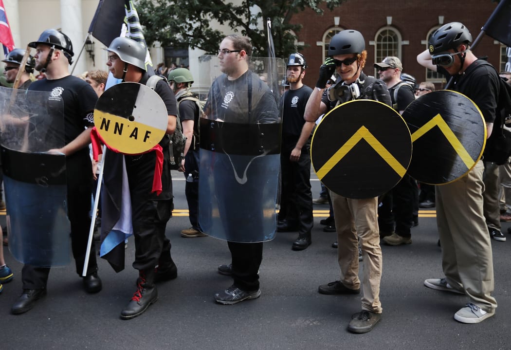 Hundreds of white nationalists, neo-Nazis and members of the "alt-right" march down East Market Street toward Emancipation Park during the United the Right rally in Virginia.