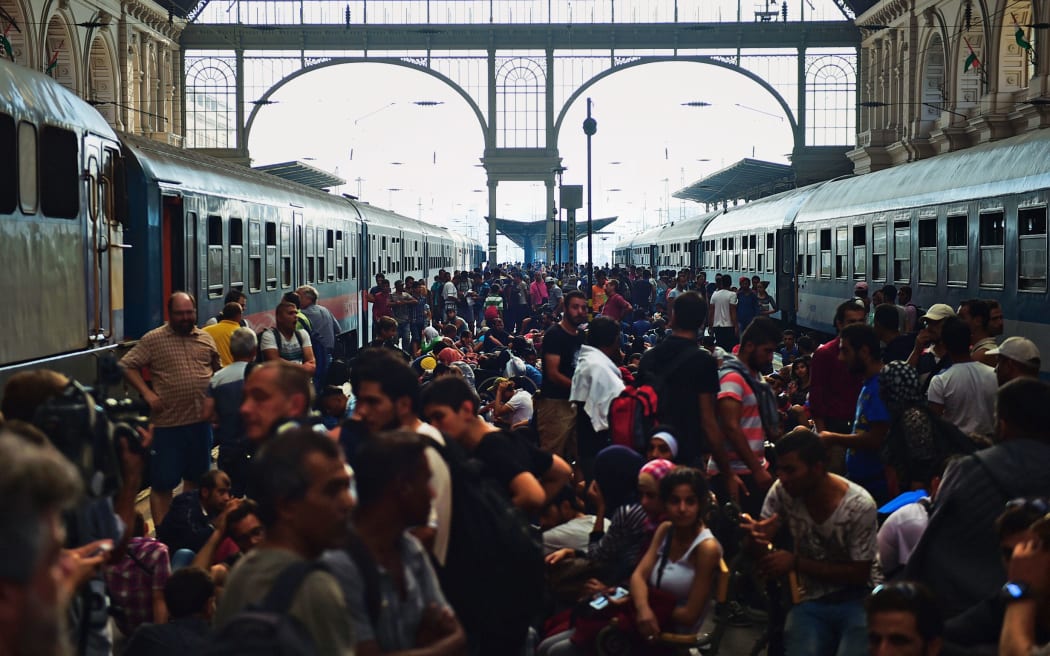 Migrants and refugees crowd the platforms at the Keleti (eastern) railway station in Budapest on September 1, 2015. Keleti, the biggest Hungarian railway station was closed today as police evacuated people trying to get on trains bound for Germany. AFP