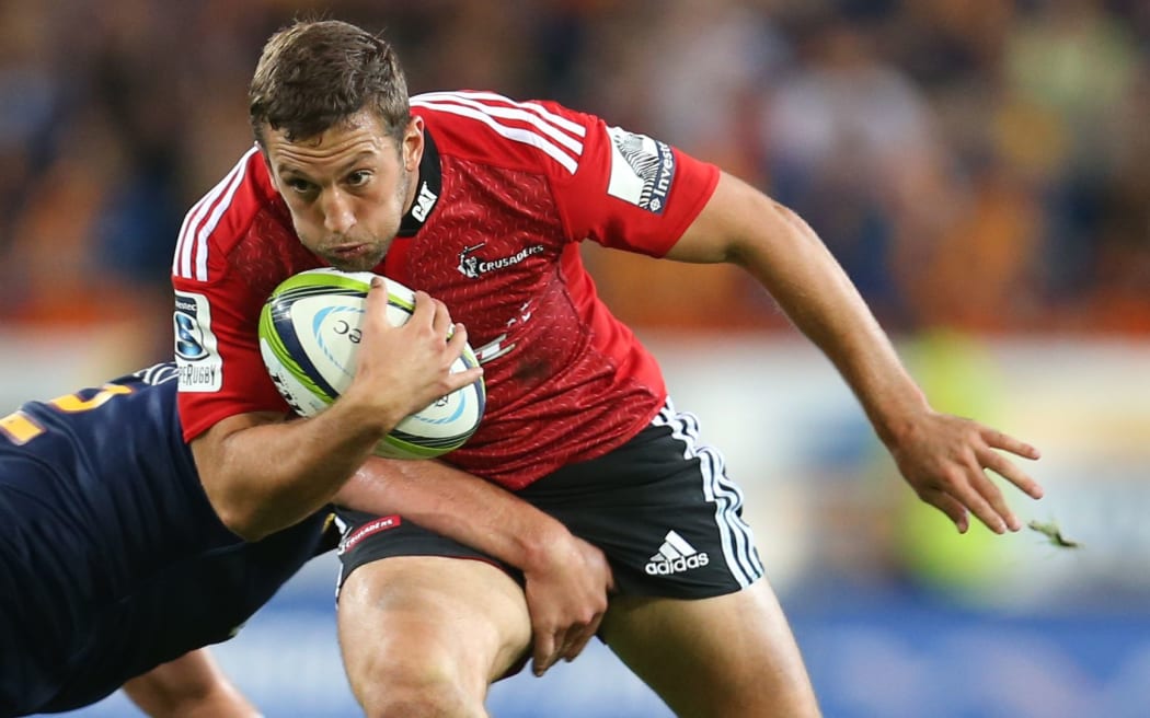 The Crusaders back Tom Taylor in action.