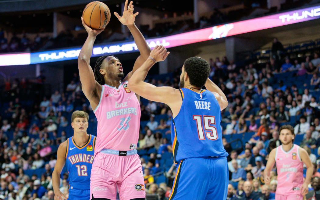 The Breakers Freddie Gillespie #33 shoots over the Thunder's Alex Reese #15 on October 10, 2024 in Tulsa, Oklahoma.