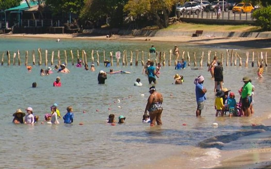 Swimmers enjoying the famous Baie des Citrons in Nouméa.
