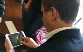Green Party co-leader Russel Norman playing a video game during party's IT policy launch