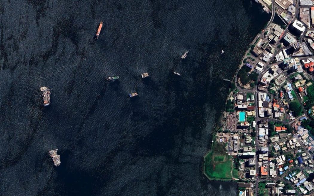 Satellite photo showing two clusters of abandoned fishing boats (left) just off the waterfront of Suva’s central business district. Pictured on Feb 26, 2025. (Google Earth)