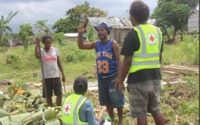 The Solomons Red Cross assist a family who lost their home in Henderson