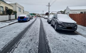 Snow-capped cars in Mornington, Dunedin on 6 September 2022.