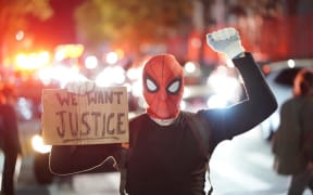 Protestor in a spiderman mask rally against the death of Minneapolis, Minnesota man George Floyd at the hands of polic.