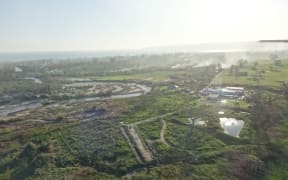 Looking over Mele Village outside of Port Vila, the river on the left burst its banks during the cyclone floodng the entire village and destroying all their food gardens.