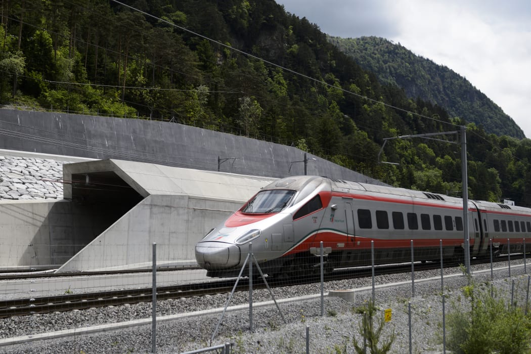 An Italian train makes its way at the north entrance of the new Gotthard Base Tunnel the world's longest train tunnel on the eve of its opening ceremony.