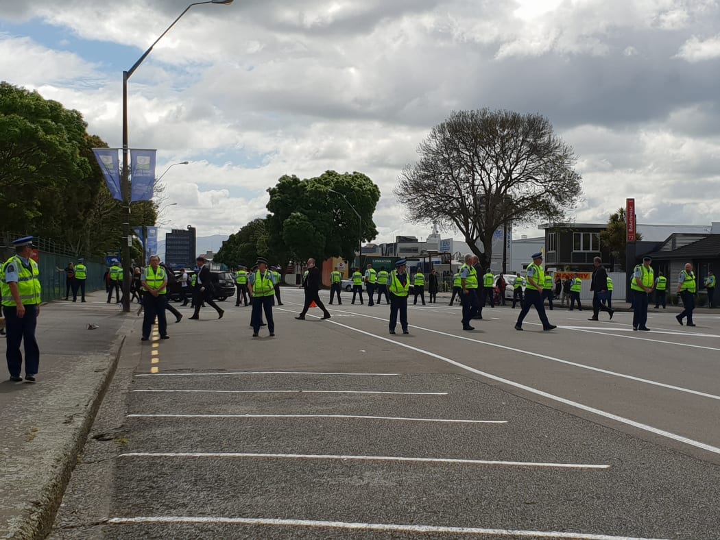 Police at a protest where the New Zealand Defence Industry Association is holding its Defence, Industry and National Security Forum in Palmerston North.