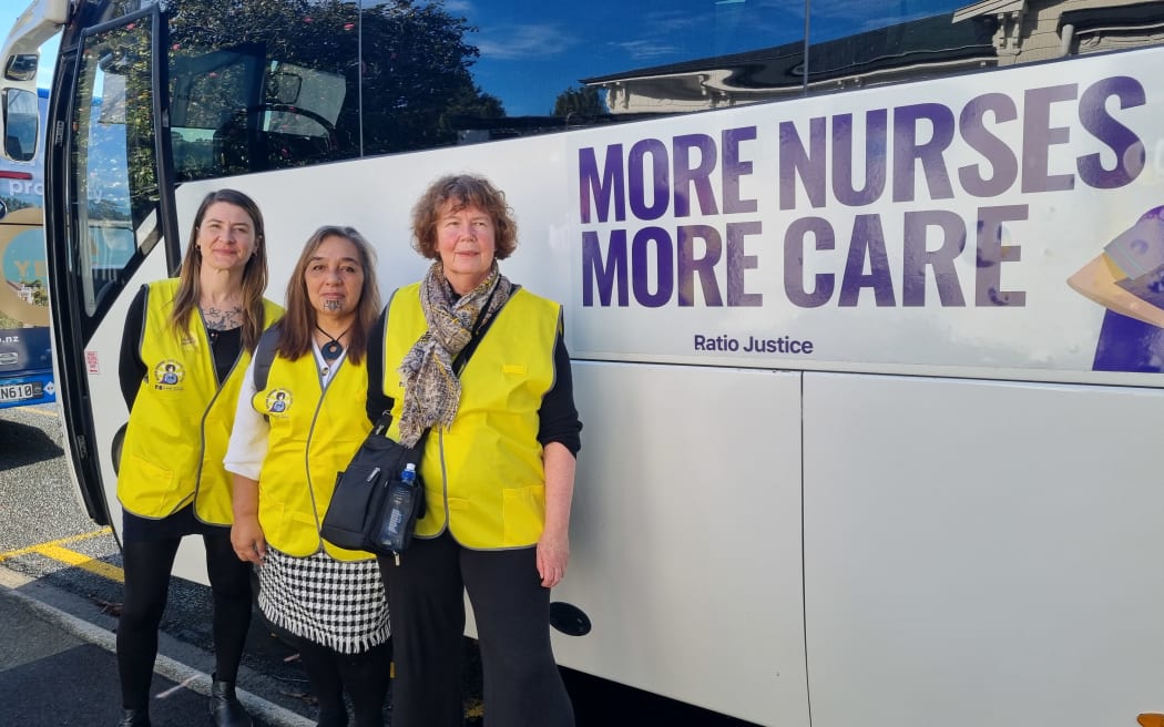 New Zealand Nurses Organisation president Anne Daniels, right, with staff and the bus that is travelling around the South Island as part of a campaign to raise awareness of the issues the health system is facing due to underfunding.