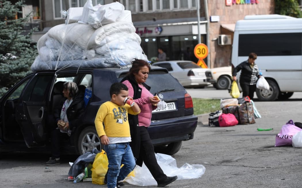 Armenian refugees from Nagorno-Karabakh are seen in the center of the town of Goris on September 30, 2023 before being evacuated in various Armenian cities.