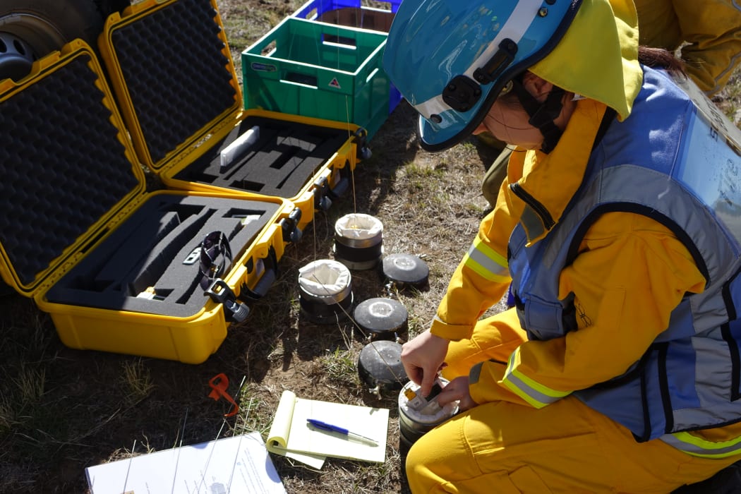 Scion fire scientist Veronica Clifford is preparing fire-proof canisters, developed in collaboration with the University of Canterbury's engineering services, that hold instrumentation to track the fire in the burn plots.