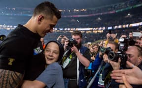 Sonny Bill Williams with the young fan indentified as Charlie Lines.