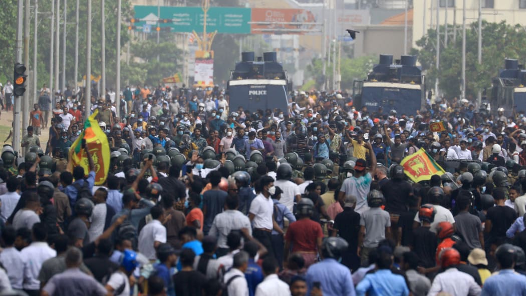 Sri Lankan anti-government and pro-government protesters clash near the president's office at Colombo, Sri Lanka.