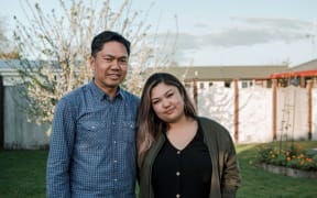 Alfredo Bernal and daughter Donally in Alfredo's garden in Kirikiriroa