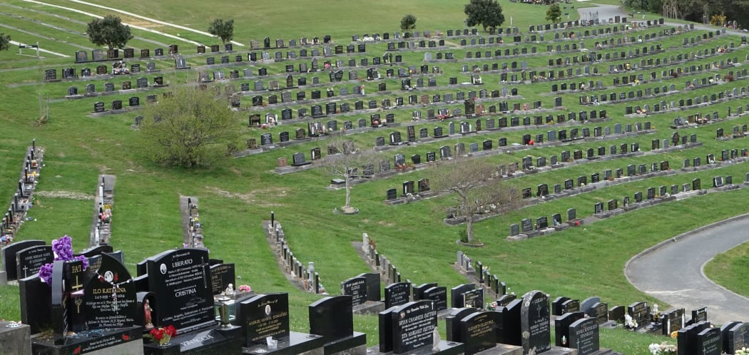 Rows of heads stones in grassy setting