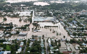 A handout photo taken and received on March 31, 2022 from the New South Wales (NSW) State Emergency Service shows floodwaters inundating the northern NSW city of Lismore. (Photo by Handout / NEW SOUTH WALES STATE EMERGENCY SERVICE / AFP) / ----EDITORS NOTE ----RESTRICTED TO EDITORIAL USE MANDATORY CREDIT " AFP PHOTO / NEW SOUTH WALES STATE EMERGENCY SERVICE" NO MARKETING NO ADVERTISING CAMPAIGNS - DISTRIBUTED AS A SERVICE TO CLIENTS