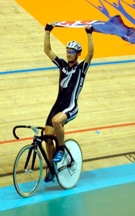 Greg Henderson celebrates winning gold at the 2002 Manchester Commonwealth Games.