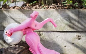 A child's pink toy bike at Island Child Charitable Trust's emergency housing